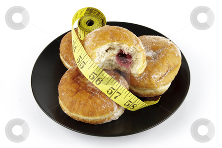 To use this stock image in your creative project, please select the size you need over to the right and click the "Add to Cart" button.
Your downloaded image will come with the Cutcaster watermark removed so don’t worry about the watermark you see on this page. Doughnuts and Tape Measure stock photo, Black round plate of jam doughnuts with a yellow tape measure on a reflective white background by Keith Wilson