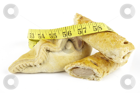 To use this stock image in your creative project, please select the size you need over to the right and click the "Add to Cart" button.
Your downloaded image will come with the Cutcaster watermark removed so don’t worry about the watermark you see on this page. Sausage Roll with Pasty and Tape Measure stock photo, Single golden sausage roll cut in half with pasty and yellow tape measure on a reflective white background by Keith Wilson