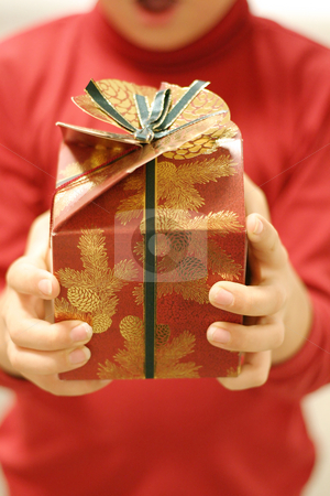 To use this stock image in your creative project, please select the size you need over to the right and click the "Add to Cart" button.
Your downloaded image will come with the Cutcaster watermark removed so don’t worry about the watermark you see on this page. Christmas Giving stock photo, Giving gifts at Christmas. Focus on the gift by Leah-Anne Thompson