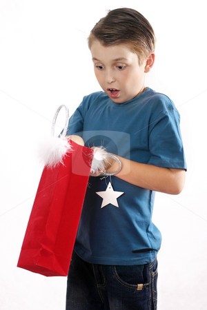 To use this stock image in your creative project, please select the size you need over to the right and click the "Add to Cart" button.
Your downloaded image will come with the Cutcaster watermark removed so don’t worry about the watermark you see on this page. Gift Surprise stock photo, Surprised face of a boy with a gift. by Leah-Anne Thompson