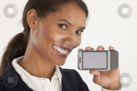 To use this stock image in your creative project, please select the size you need over to the right and click the "Add to Cart" button.
Your downloaded image will come with the Cutcaster watermark removed so don’t worry about the watermark you see on this page. Young Businesswoman with Mobile Device stock photo, Closeup of young businesswoman holding mobile device. Horizontally framed shot. by Edward Bock