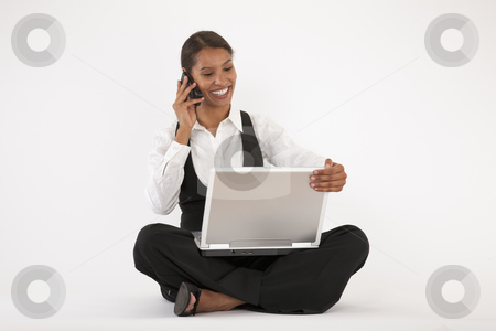 To use this stock image in your creative project, please select the size you need over to the right and click the "Add to Cart" button.
Your downloaded image will come with the Cutcaster watermark removed so don’t worry about the watermark you see on this page. Young Woman Using Laptop and Cell Phone stock photo, Young woman sitting on floor using laptop and cell phone. Horizontally format. by Edward Bock