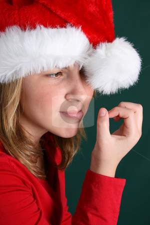 To use this stock image in your creative project, please select the size you need over to the right and click the "Add to Cart" button.
Your downloaded image will come with the Cutcaster watermark removed so don’t worry about the watermark you see on this page. Christmas Boredom stock photo, Teenager in red shirt and fluffy christmas hat by Vanessa Van Rensburg