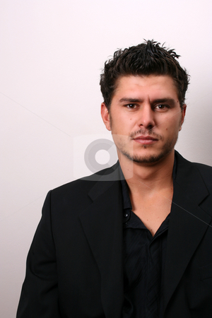 To use this stock image in your creative project, please select the size you need over to the right and click the "Add to Cart" button.
Your downloaded image will come with the Cutcaster watermark removed so don’t worry about the watermark you see on this page. Male Model in Suit stock photo, Male model in studio against white wall by Vanessa Van Rensburg