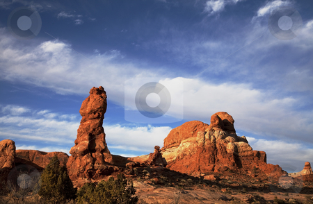 To use this stock image in your creative project, please select the size you need over to the right and click the "Add to Cart" button.
Your downloaded image will come with the Cutcaster watermark removed so don’t worry about the watermark you see on this page. Arches National Park stock photo, View of the red rock formations in Arches National Park with blue sky by Mark Smith