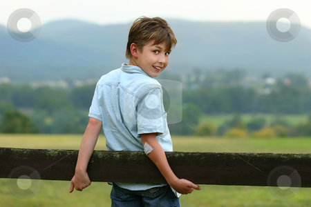 To use this stock image in your creative project, please select the size you need over to the right and click the "Add to Cart" button.
Your downloaded image will come with the Cutcaster watermark removed so don’t worry about the watermark you see on this page. Down on the farm stock photo, A young happy boy in the paddock on an overcast afternoon. f 3.5 by Leah-Anne Thompson