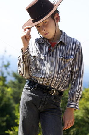 To use this stock image in your creative project, please select the size you need over to the right and click the "Add to Cart" button.
Your downloaded image will come with the Cutcaster watermark removed so don’t worry about the watermark you see on this page. Country boy tipping his hat stock photo, A courteous country boy in denim jeans and button shirt tips his hat. by Leah-Anne Thompson