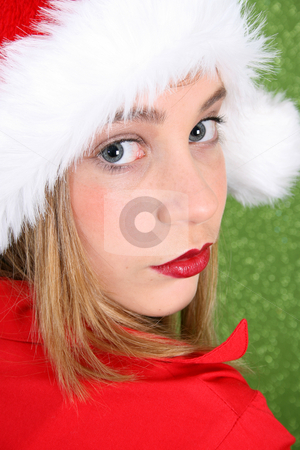 To use this stock image in your creative project, please select the size you need over to the right and click the "Add to Cart" button.
Your downloaded image will come with the Cutcaster watermark removed so don’t worry about the watermark you see on this page. Christmas Teen stock photo, Teenager with red lips wearing a christmas hat by Vanessa Van Rensburg