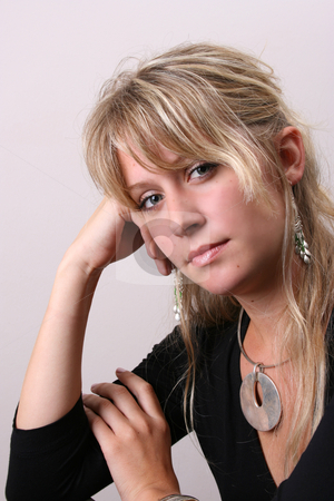 To use this stock image in your creative project, please select the size you need over to the right and click the "Add to Cart" button.
Your downloaded image will come with the Cutcaster watermark removed so don’t worry about the watermark you see on this page. Blond Model in Black stock photo, Blond Female model on a white background wearing a blue top by Vanessa Van Rensburg