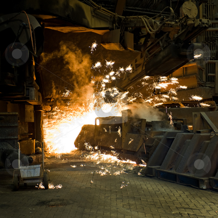 To use this stock image in your creative project, please select the size you need over to the right and click the "Add to Cart" button.
Your downloaded image will come with the Cutcaster watermark removed so don’t worry about the watermark you see on this page. Industrial furnace stock photo, Huge drill creating a pouring hole in an industrial furnace - sparks flying everywhere by Corepics VOF
