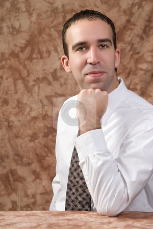 To use this stock image in your creative project, please select the size you need over to the right and click the "Add to Cart" button.
Your downloaded image will come with the Cutcaster watermark removed so don’t worry about the watermark you see on this page. Business Portrait stock photo, A young businessman leaning on his fist with some copyspace room on the left side by Richard Nelson