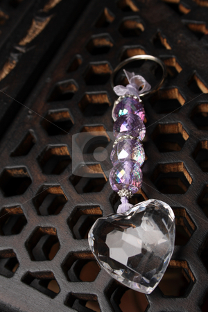 To use this stock image in your creative project, please select the size you need over to the right and click the "Add to Cart" button.
Your downloaded image will come with the Cutcaster watermark removed so don’t worry about the watermark you see on this page. Purple Heart stock photo, Purple Crystal Heart on a carved wooden background by Vanessa Van Rensburg