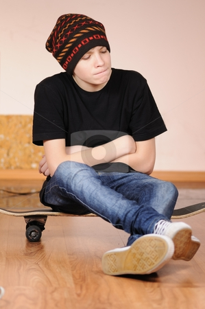 To use this stock image in your creative project, please select the size you need over to the right and click the "Add to Cart" button.
Your downloaded image will come with the Cutcaster watermark removed so don’t worry about the watermark you see on this page. The teenager with a skateboard stock photo, The teenager with a skateboard and in a hat by Salauyou Yury