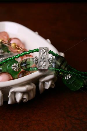 To use this stock image in your creative project, please select the size you need over to the right and click the "Add to Cart" button.
Your downloaded image will come with the Cutcaster watermark removed so don’t worry about the watermark you see on this page. Jewelery stock photo, Beaded Jewelery set in a decorated ceramic dish by Vanessa Van Rensburg