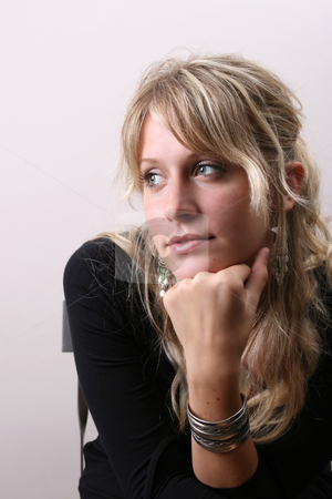To use this stock image in your creative project, please select the size you need over to the right and click the "Add to Cart" button.
Your downloaded image will come with the Cutcaster watermark removed so don’t worry about the watermark you see on this page. Blond Model stock photo, Blond Female model on a white background wearing a black top by Vanessa Van Rensburg