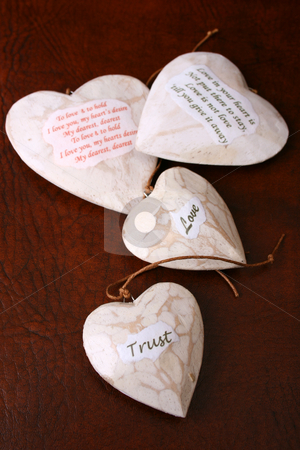 To use this stock image in your creative project, please select the size you need over to the right and click the "Add to Cart" button.
Your downloaded image will come with the Cutcaster watermark removed so don’t worry about the watermark you see on this page. Wooden Hearts stock photo, Wooden heart decorations with words of wisdom by Vanessa Van Rensburg