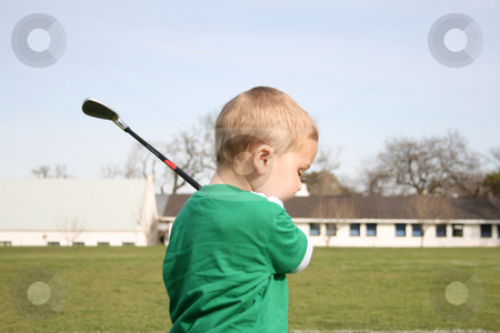 To use this stock image in your creative project, please select the size you need over to the right and click the "Add to Cart" button.
Your downloaded image will come with the Cutcaster watermark removed so don’t worry about the watermark you see on this page. Golfing Toddler stock photo, Young boy practising golf on the driving range
Toddler practising golf on the driving range by Vanessa Van Rensburg