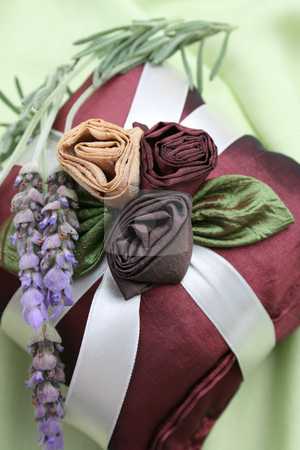 To use this stock image in your creative project, please select the size you need over to the right and click the "Add to Cart" button.
Your downloaded image will come with the Cutcaster watermark removed so don’t worry about the watermark you see on this page. Fragrance Pillows stock photo, Burgundy Colored Fragrance Pillows with fresh lavendar by Vanessa Van Rensburg