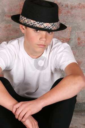 To use this stock image in your creative project, please select the size you need over to the right and click the "Add to Cart" button.
Your downloaded image will come with the Cutcaster watermark removed so don’t worry about the watermark you see on this page. Casual Teen stock photo, Teenage boy wearing a black hat in casual wear by Vanessa Van Rensburg