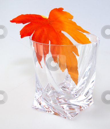 To use this stock image in your creative project, please select the size you need over to the right and click the "Add to Cart" button.
Your downloaded image will come with the Cutcaster watermark removed so don’t worry about the watermark you see on this page. Maple leaf in a glass stock photo, Crystal glass with maple leaf on white background by Fabio Alcini