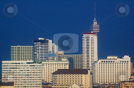 To use this stock image in your creative project, please select the size you need over to the right and click the "Add to Cart" button.
Your downloaded image will come with the Cutcaster watermark removed so don’t worry about the watermark you see on this page. Tower and skyscrapers stock photo, Tower and skyscrapers with vibrant blue sky. by Oleg Blazhyievskyi