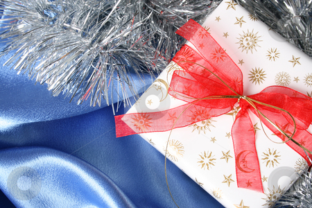 To use this stock image in your creative project, please select the size you need over to the right and click the "Add to Cart" button.
Your downloaded image will come with the Cutcaster watermark removed so don’t worry about the watermark you see on this page. Christmas Gifts stock photo, Wrapped christmas gifts with tinsel and bow by Vanessa Van Rensburg
