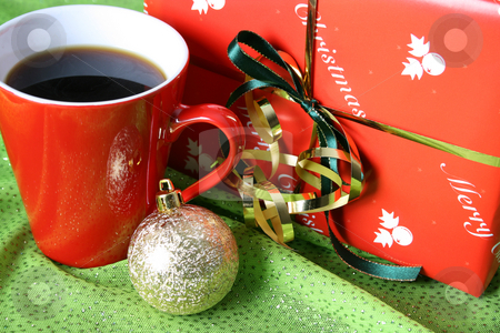 To use this stock image in your creative project, please select the size you need over to the right and click the "Add to Cart" button.
Your downloaded image will come with the Cutcaster watermark removed so don’t worry about the watermark you see on this page. Christmas Day Coffee stock photo, Christmas morning coffee with a gift and decoration by Vanessa Van Rensburg