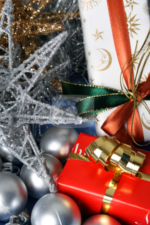 To use this stock image in your creative project, please select the size you need over to the right and click the "Add to Cart" button.
Your downloaded image will come with the Cutcaster watermark removed so don’t worry about the watermark you see on this page. Christmas Gifts stock photo, Wrapped christmas gifts with tinsel and decorations by Vanessa Van Rensburg
