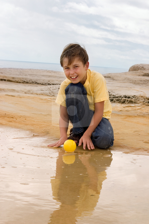 To use this stock image in your creative project, please select the size you need over to the right and click the "Add to Cart" button.
Your downloaded image will come with the Cutcaster watermark removed so don’t worry about the watermark you see on this page. Playing in water stock photo, Child plays with a ball in water. by Leah-Anne Thompson