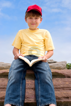 To use this stock image in your creative project, please select the size you need over to the right and click the "Add to Cart" button.
Your downloaded image will come with the Cutcaster watermark removed so don’t worry about the watermark you see on this page. Sitting Boy with Book stock photo, Child holding a book sitting against blue sky by Leah-Anne Thompson