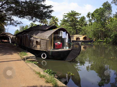 To use this stock image in your creative project, please select the size you need over to the right and click the "Add to Cart" button.
Your downloaded image will come with the Cutcaster watermark removed so don’t worry about the watermark you see on this page. Keralan houseboat stock photo, Keralan houseboats at their moorings in kumarakom south india by Mike Smith