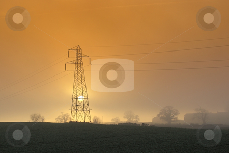 To use this stock image in your creative project, please select the size you need over to the right and click the "Add to Cart" button.
Your downloaded image will come with the Cutcaster watermark removed so don’t worry about the watermark you see on this page. Setting sun with pylon stock photo, The sun setting behind a pylon on a hillside on a misty winter evening by Mike Smith