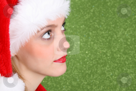 To use this stock image in your creative project, please select the size you need over to the right and click the "Add to Cart" button.
Your downloaded image will come with the Cutcaster watermark removed so don’t worry about the watermark you see on this page. Christmas Teen stock photo, Teenager with red lips wearing a christmas hat by Vanessa Van Rensburg