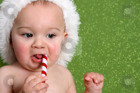 To use this stock image in your creative project, please select the size you need over to the right and click the "Add to Cart" button.
Your downloaded image will come with the Cutcaster watermark removed so don’t worry about the watermark you see on this page. Christmas Baby stock photo, Christmas Baby playing with decorations on a green background by Vanessa Van Rensburg
