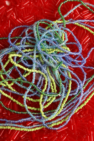 To use this stock image in your creative project, please select the size you need over to the right and click the "Add to Cart" button.
Your downloaded image will come with the Cutcaster watermark removed so don’t worry about the watermark you see on this page. Beads stock photo, Strings of blue and green beads ontop of red beads by Vanessa Van Rensburg