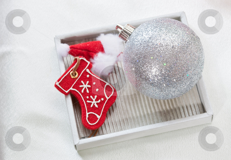 To use this stock image in your creative project, please select the size you need over to the right and click the "Add to Cart" button.
Your downloaded image will come with the Cutcaster watermark removed so don’t worry about the watermark you see on this page. Christmas decoration stock photo, Holiday series: Christmas ball and boot decoration by Gennady Kravetsky