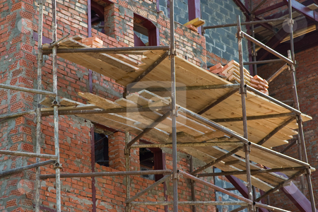 To use this stock image in your creative project, please select the size you need over to the right and click the "Add to Cart" button.
Your downloaded image will come with the Cutcaster watermark removed so don’t worry about the watermark you see on this page. Under construstion stock photo, City series: building under construction with scaffolding by Gennady Kravetsky