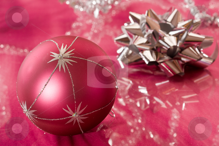 To use this stock image in your creative project, please select the size you need over to the right and click the "Add to Cart" button.
Your downloaded image will come with the Cutcaster watermark removed so don’t worry about the watermark you see on this page. Christmas decoration stock photo, Holiday series: Christmas bow and ball decoration on the red by Gennady Kravetsky