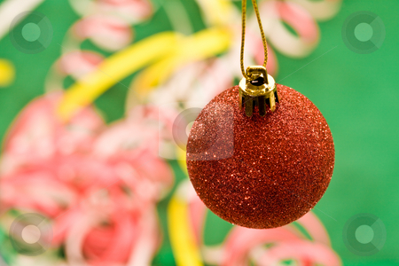 To use this stock image in your creative project, please select the size you need over to the right and click the "Add to Cart" button.
Your downloaded image will come with the Cutcaster watermark removed so don’t worry about the watermark you see on this page. Christmas decoration stock photo, Holiday series: red Christmas ball and decorated background by Gennady Kravetsky