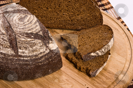 To use this stock image in your creative project, please select the size you need over to the right and click the "Add to Cart" button.
Your downloaded image will come with the Cutcaster watermark removed so don’t worry about the watermark you see on this page. Brown bread stock photo, Food series: round of brown tasty bread by Gennady Kravetsky