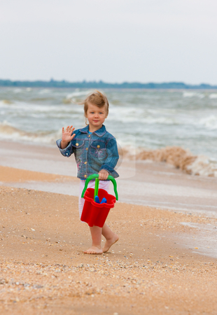 To use this stock image in your creative project, please select the size you need over to the right and click the "Add to Cart" button.
Your downloaded image will come with the Cutcaster watermark removed so don’t worry about the watermark you see on this page. Recreation on the beach stock photo, People series: little girl on the beach play with toy by Gennady Kravetsky