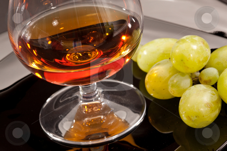 To use this stock image in your creative project, please select the size you need over to the right and click the "Add to Cart" button.
Your downloaded image will come with the Cutcaster watermark removed so don’t worry about the watermark you see on this page. Brandy stock photo, Drink series: glass of cognac grapes on the black plate by Gennady Kravetsky