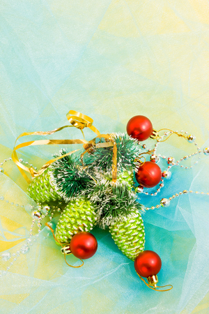 To use this stock image in your creative project, please select the size you need over to the right and click the "Add to Cart" button.
Your downloaded image will come with the Cutcaster watermark removed so don’t worry about the watermark you see on this page. Christmas decoration stock photo, Holiday series: christmas red ball and green cone on blue cloth by Gennady Kravetsky