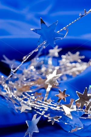 To use this stock image in your creative project, please select the size you need over to the right and click the "Add to Cart" button.
Your downloaded image will come with the Cutcaster watermark removed so don’t worry about the watermark you see on this page. Star shaped garland stock photo, Holiday series: star shaped silver Christmas garland and bell by Gennady Kravetsky