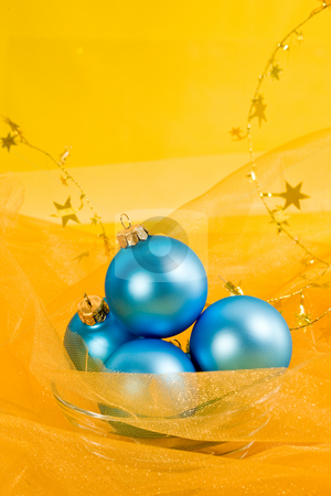 To use this stock image in your creative project, please select the size you need over to the right and click the "Add to Cart" button.
Your downloaded image will come with the Cutcaster watermark removed so don’t worry about the watermark you see on this page. Christmas decoration stock photo, Holiday series: christmas blue ball and garland on yellow by Gennady Kravetsky