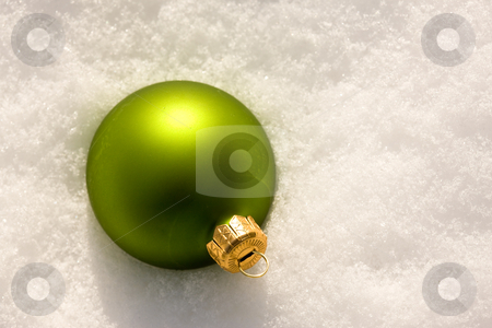 To use this stock image in your creative project, please select the size you need over to the right and click the "Add to Cart" button.
Your downloaded image will come with the Cutcaster watermark removed so don’t worry about the watermark you see on this page. Christmas decoration stock photo, Holiday series: Christmas green ball decoration and snow by Gennady Kravetsky