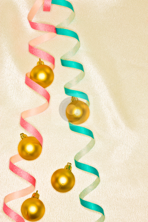 To use this stock image in your creative project, please select the size you need over to the right and click the "Add to Cart" button.
Your downloaded image will come with the Cutcaster watermark removed so don’t worry about the watermark you see on this page. Christmas decoration stock photo, Holiday series: Christmas golden ball decoration and streamer by Gennady Kravetsky