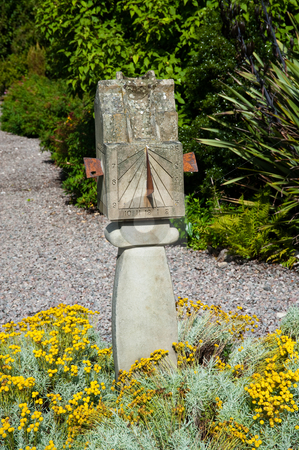 To use this stock image in your creative project, please select the size you need over to the right and click the "Add to Cart" button.
Your downloaded image will come with the Cutcaster watermark removed so don’t worry about the watermark you see on this page. Sundial stock photo, Old sundial in a garden by Jaime Pharr