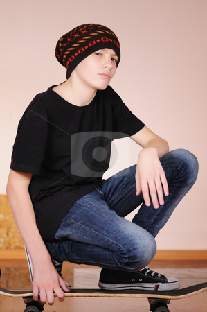 To use this stock image in your creative project, please select the size you need over to the right and click the "Add to Cart" button.
Your downloaded image will come with the Cutcaster watermark removed so don’t worry about the watermark you see on this page. The teenager with a skateboard stock photo, The teenager with a skateboard and in a hat isolated on white background by Salauyou Yury
