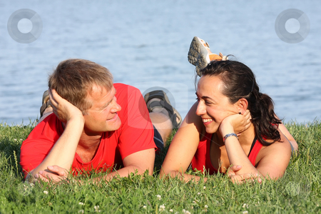 To use this stock image in your creative project, please select the size you need over to the right and click the "Add to Cart" button.
Your downloaded image will come with the Cutcaster watermark removed so don’t worry about the watermark you see on this page. Young couple stock photo, Joyful young pair is overlaping shore of the lake by ARPAD RADOCZY